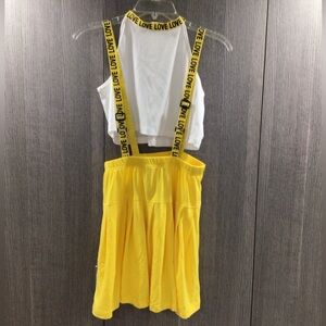 Yellow and white shirt and skirt overalls set for children